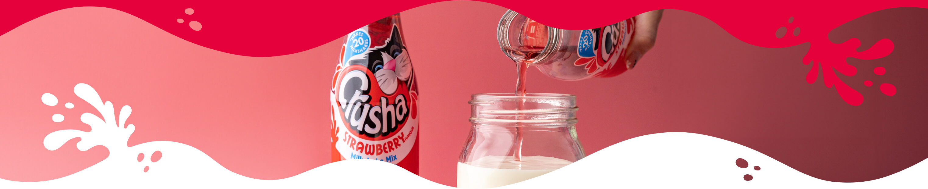 Mixing Crusha with milk - pouring strawberry Crusha into a jar of milk.